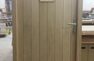 Oak tongue and groove door with glazed panel outside