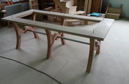 Oak table with steel rail in construction