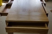 Solid oak table with dovetail joined drawers open 1