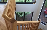 Handrail for open riser staircase with spindles